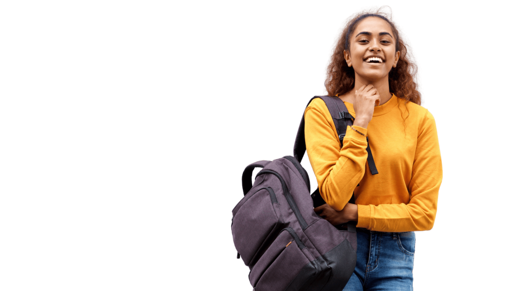 A young woman holding a backpack and smiling.